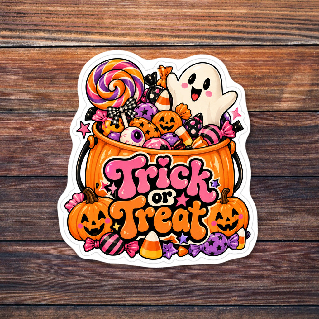 Die-cut sticker of an orange trick-or-treat bucket overflowing with candy, including a swirl lollipop, candy corn, wrapped candies and eyeball candy, with a smiling white ghost, jack-o'-lanterns, a gingham bow and stars, under bubbly lettering that reads Trick or Treat. shown on a wooden table